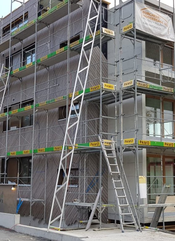 MFH Sonnenheim Reinach MFH Sonnenheim in Reinach AG im Rohbau mit Gerüst – Heizung und Sanitär von SOS Gebäudetechnik